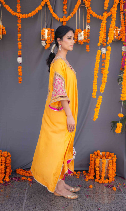 Yellow kaftaan with magenta pants and dupatta