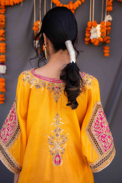 Yellow kaftaan with magenta pants and dupatta