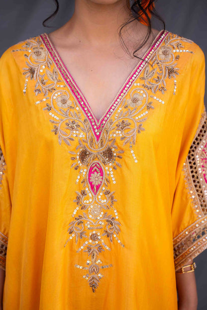 Yellow kaftaan with magenta pants and dupatta