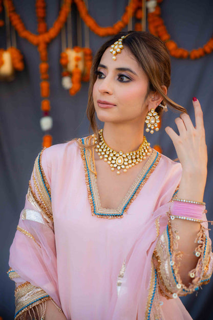 Rosegold shirt with blue pants and organza dupatta